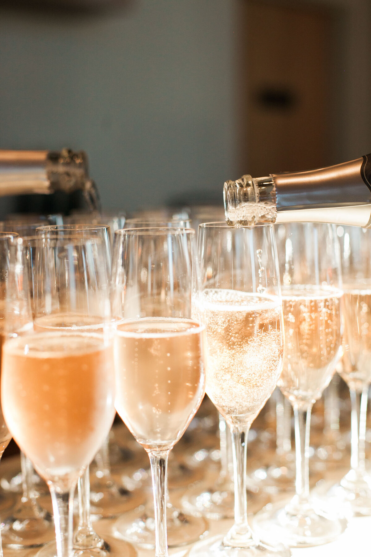champagne toast being poured at ponzi vineyard winery during wedding toast