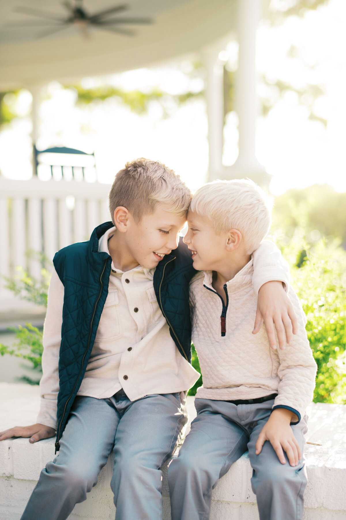 Brothers snuggle and touch foreheads at the Carolina Manor in Franklinton NC. Image by Raleigh maternity photographer A.J. Dunlap Photography.