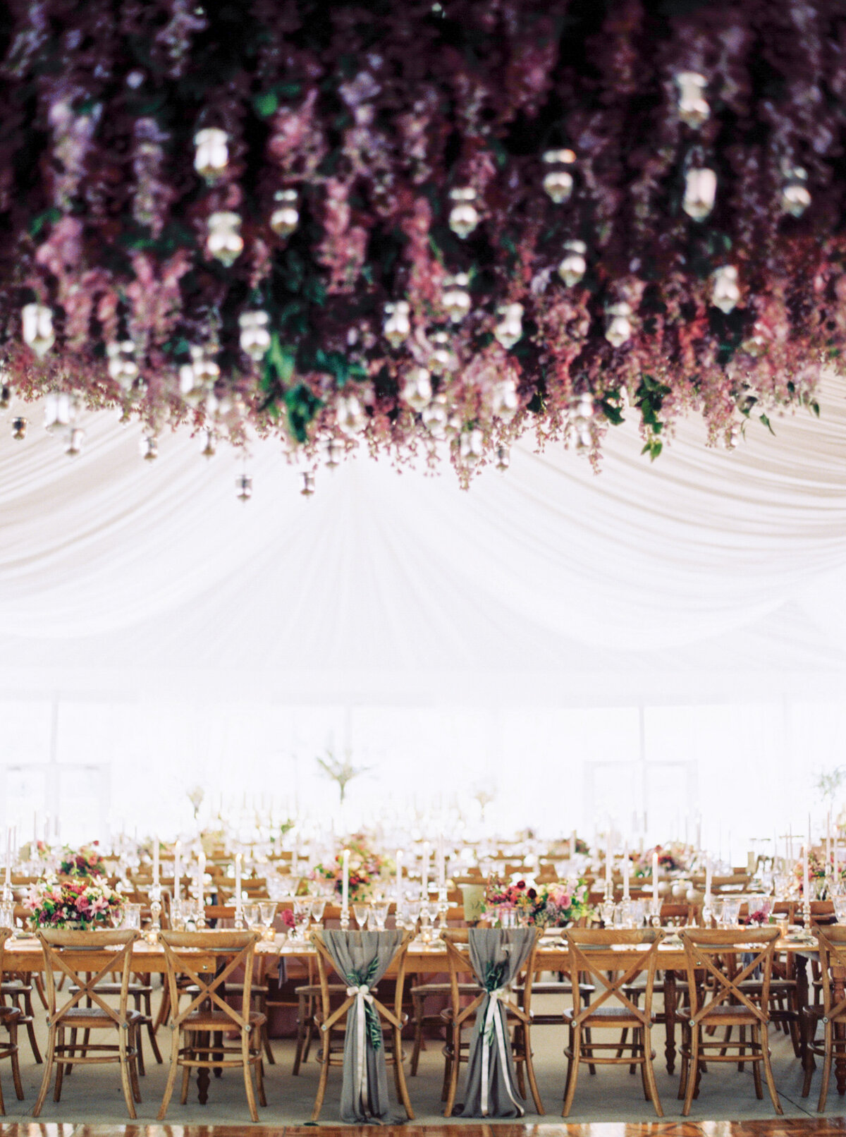 tented-outdoor-wedding-lavender-ceiling-floral-installation