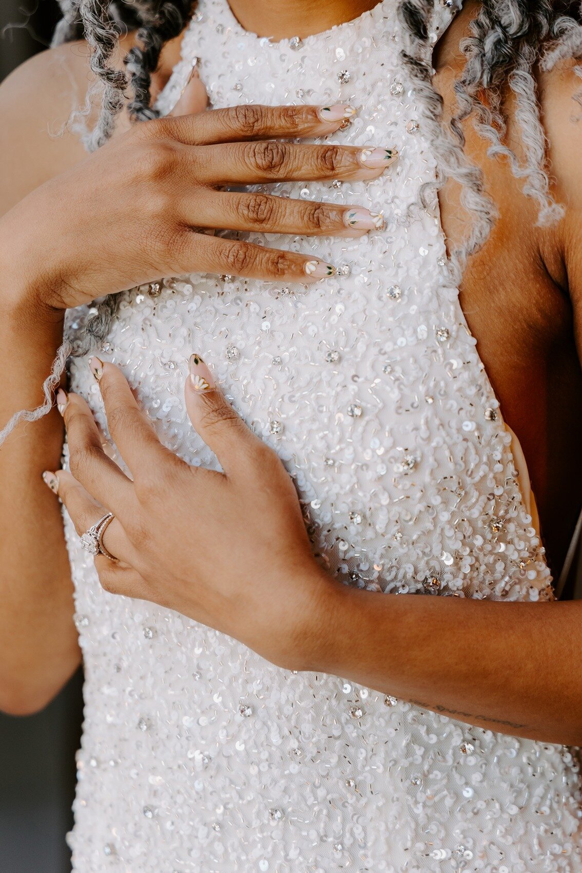 Brides wedding dress with white and transparent gems