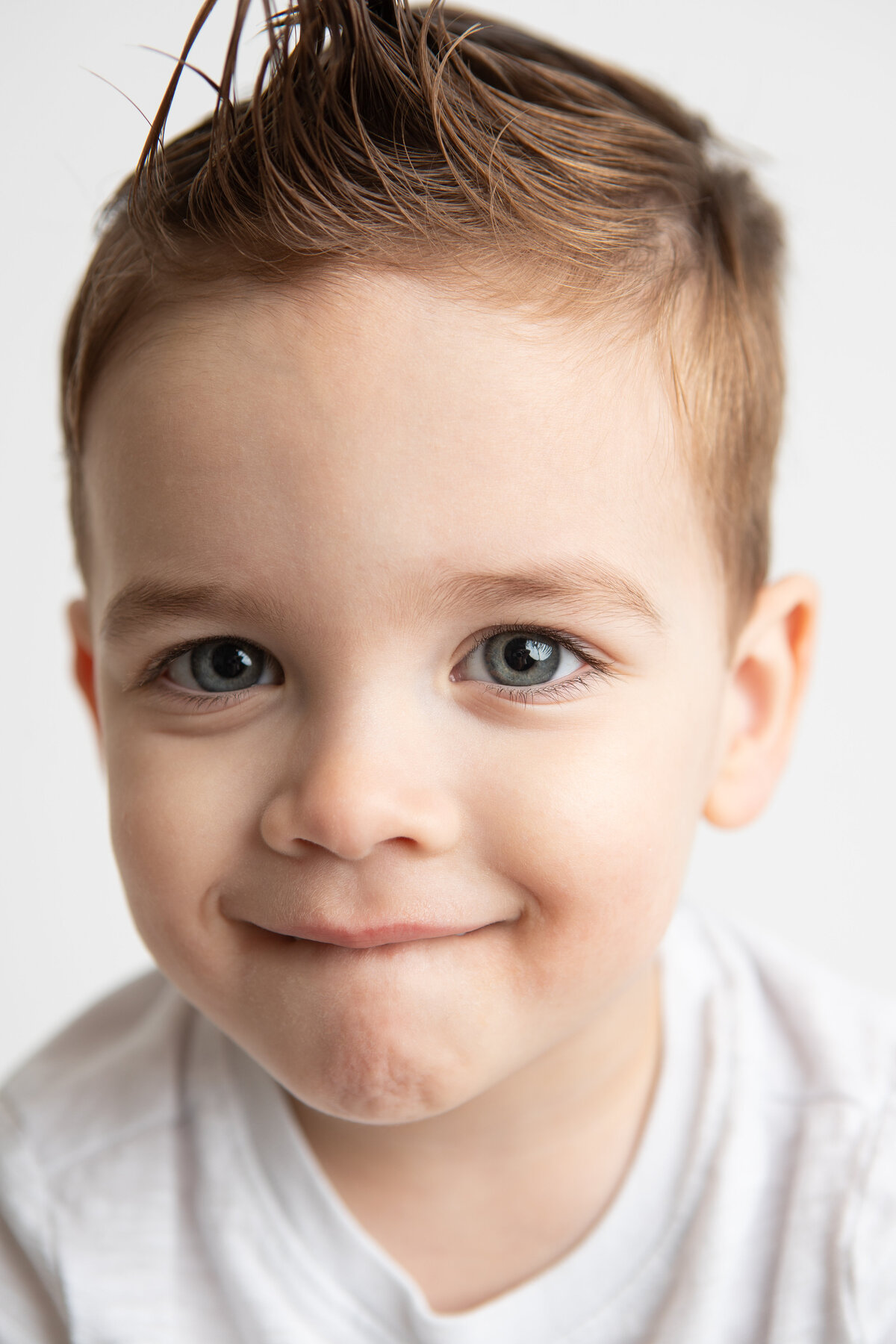 Close up studio portrait of a young boy