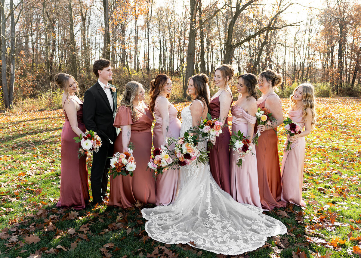bride with bridesmaids and bridesman holding bouquets at The Wellspring in Wooster, Ohio