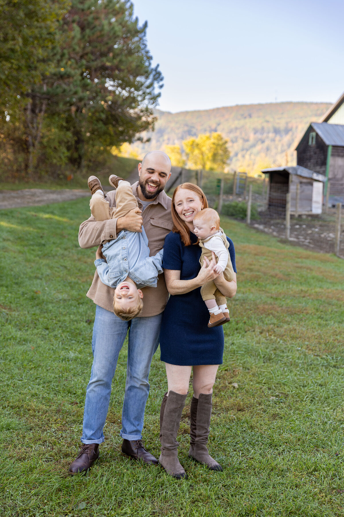 Smiling family portrait outdoors in Albany NY during fall foliage