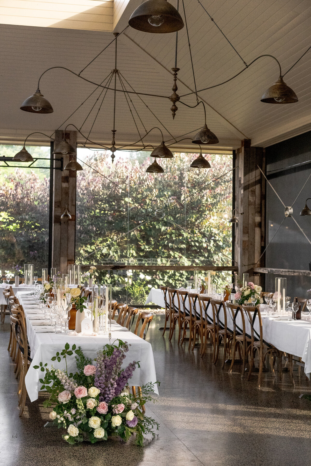 Reception set-up with fresh flowers at rustic venue