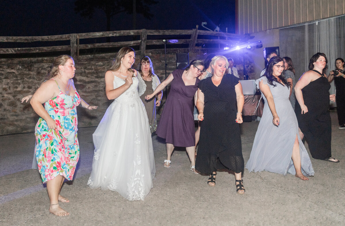 bride and friends dancing at  reception in  Columbus Georgia by wedding photographer Amanda Richardson Photogrphy