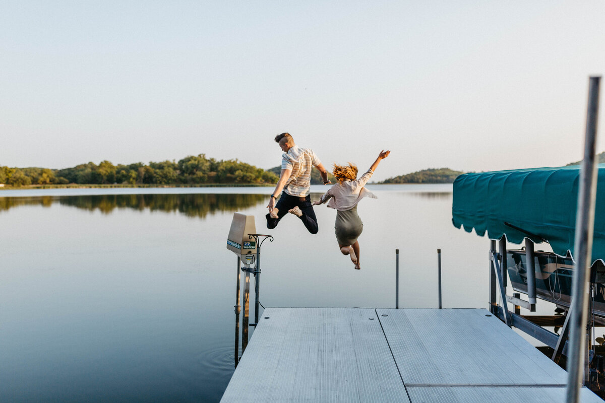 couple-jumping-into-lake