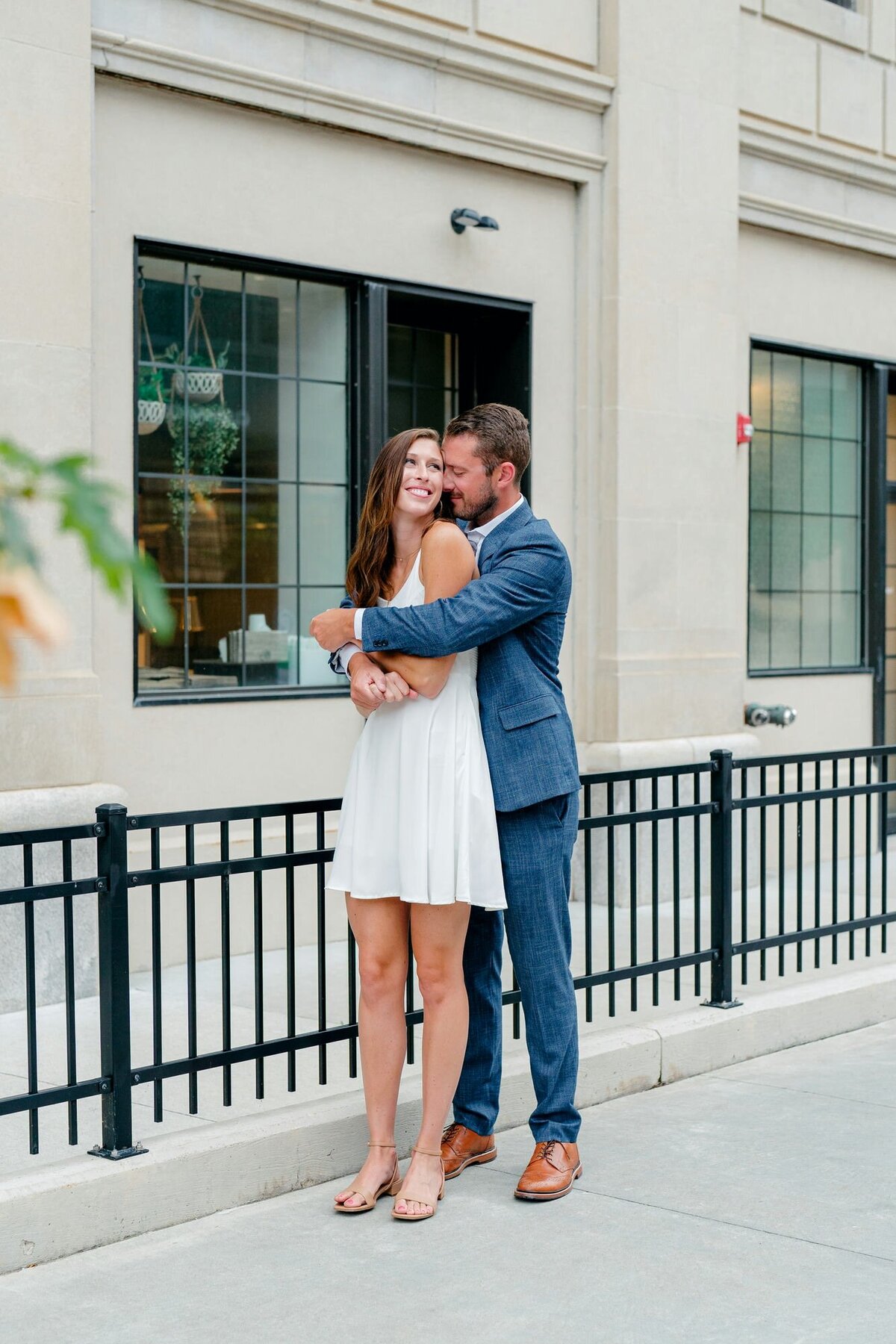couple-embracing-smiling-urban-setting-engagement