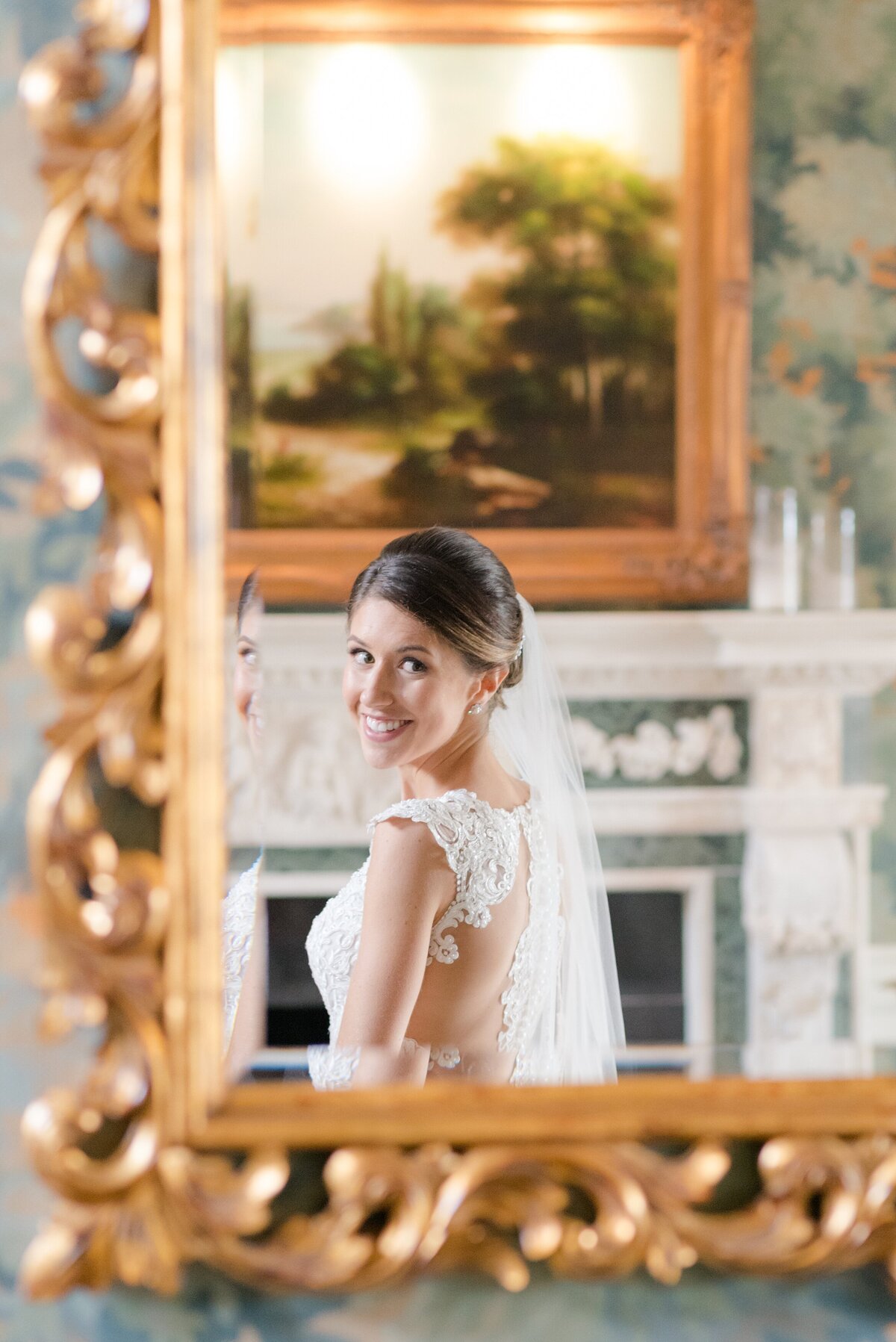 11_bride-checks-herself-in-gold-mirror_6001