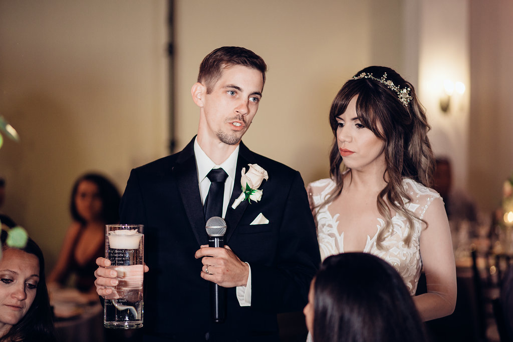 Wedding Photograph Of Groom Speaking In Microphone Beside Bride Los Angeles