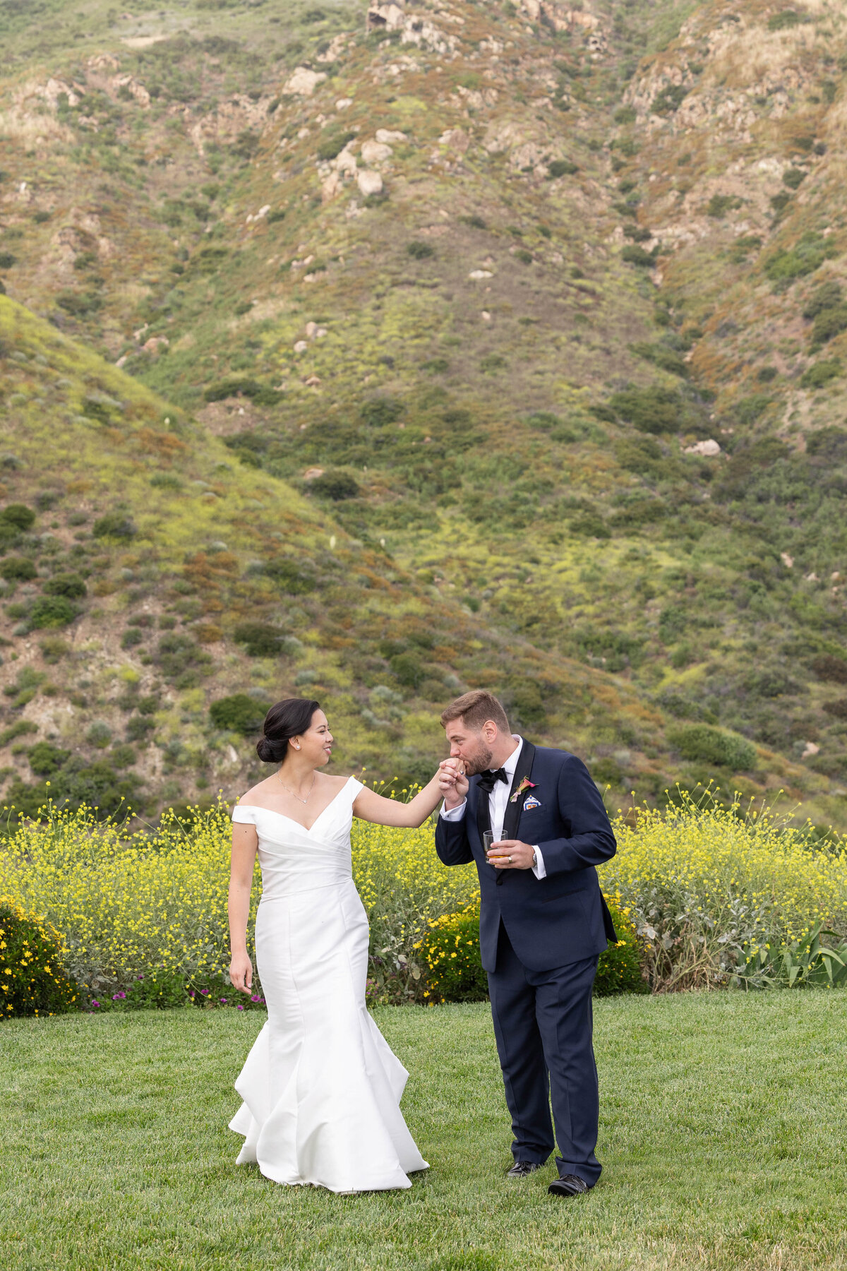 Groom Kissing the hand of his bride