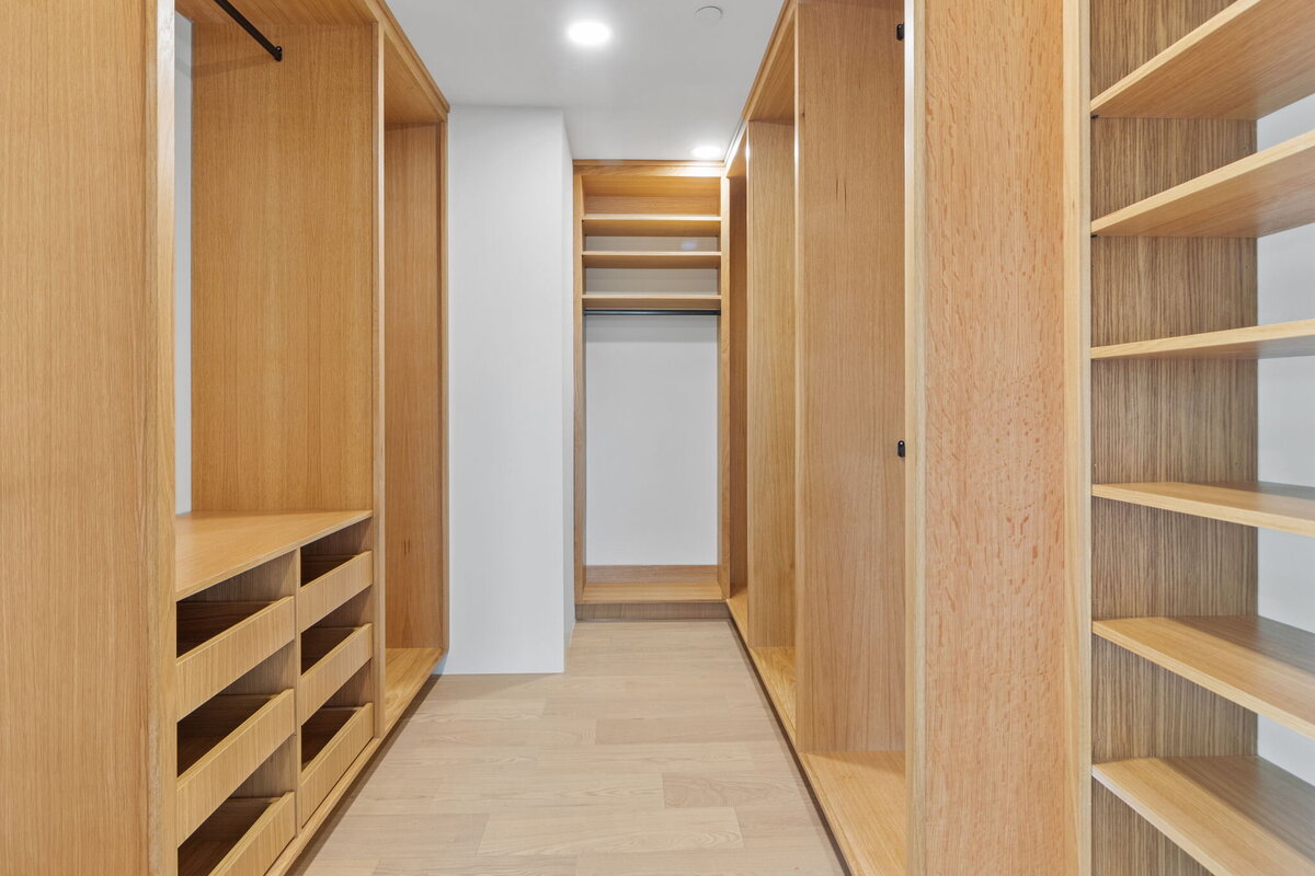 custom-walk-in-closet-light-wood-built-ins