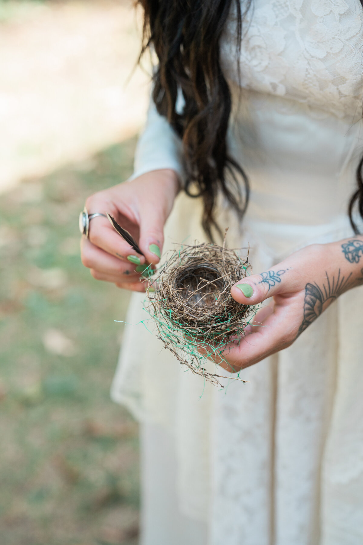 A bride holding a small ball of vines