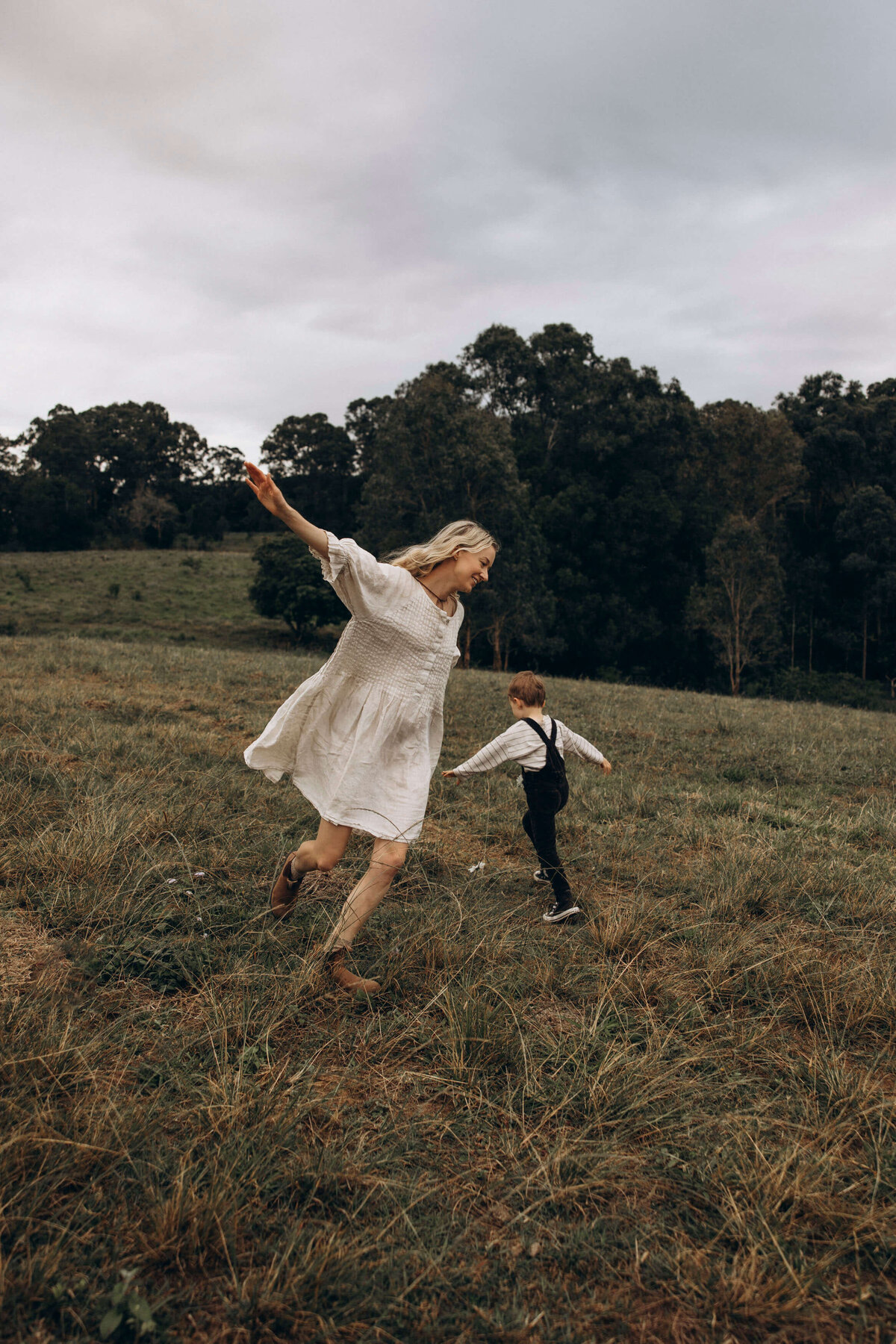 mother and child playing in a field