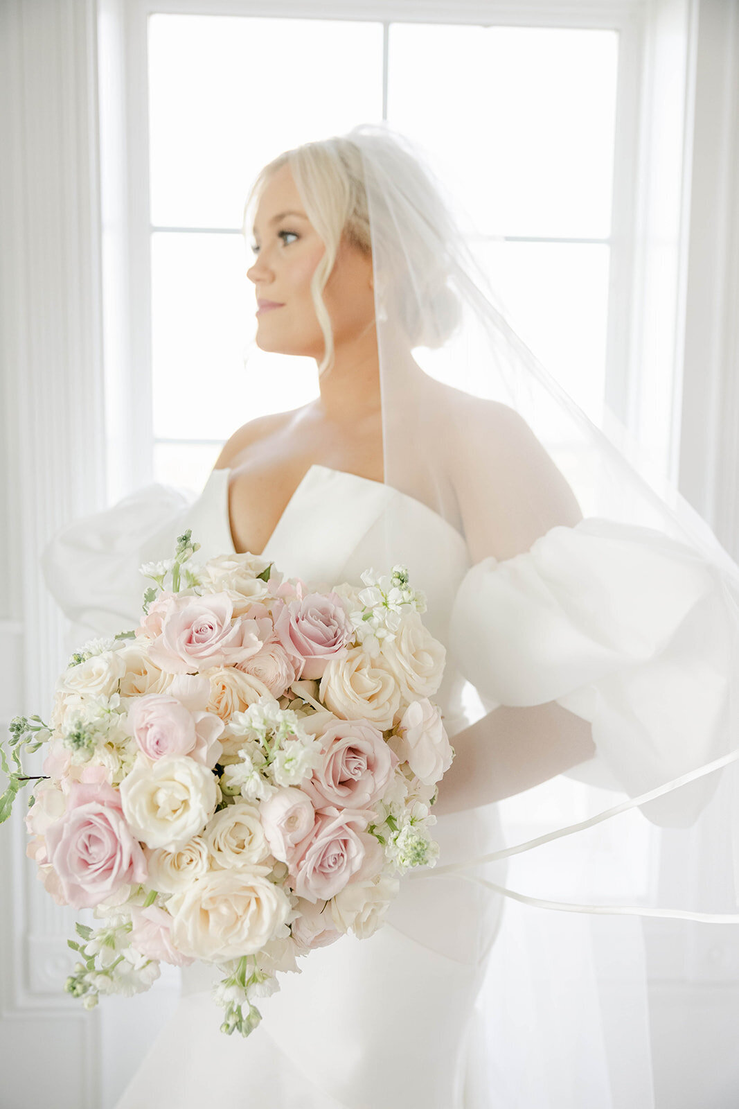 A soft and dreamy garden-style bouquet with a variety of flowers in a loose, organic arrangement.