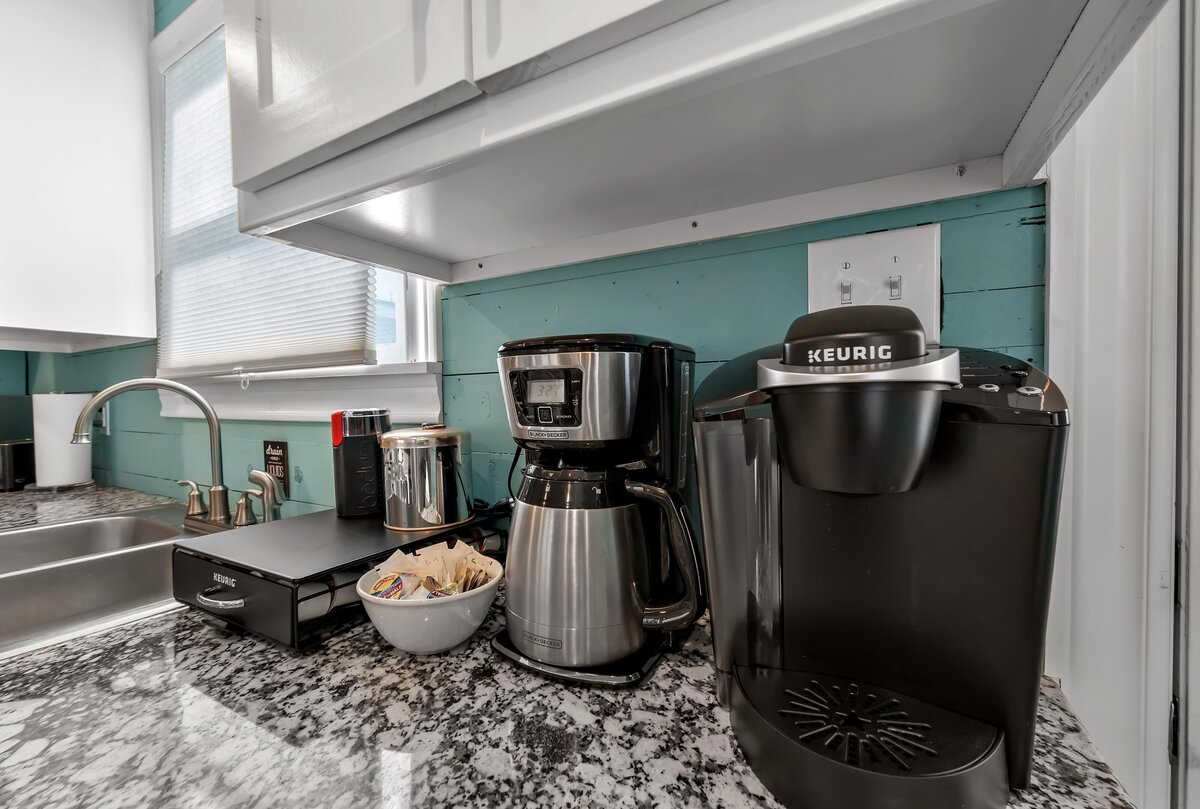 Fully stocked kitchen with Keurig and drip coffee machines in this three-bedroom, two-bathroom vacation rental house with free Wifi, fully equipped kitchen, office space, and room for six in downtown Waco, TX.