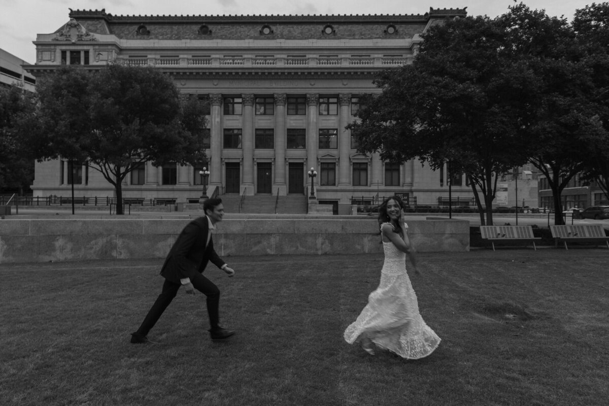 groom playfully chases bride after wedding ceremony in texas