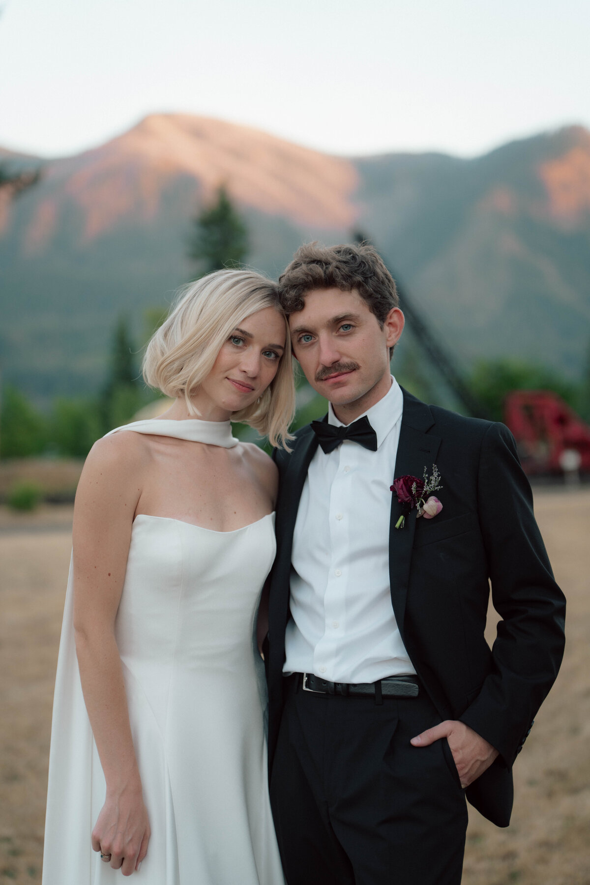 Romantic couple portrait in front of Cascade Mountains during outdoor wedding