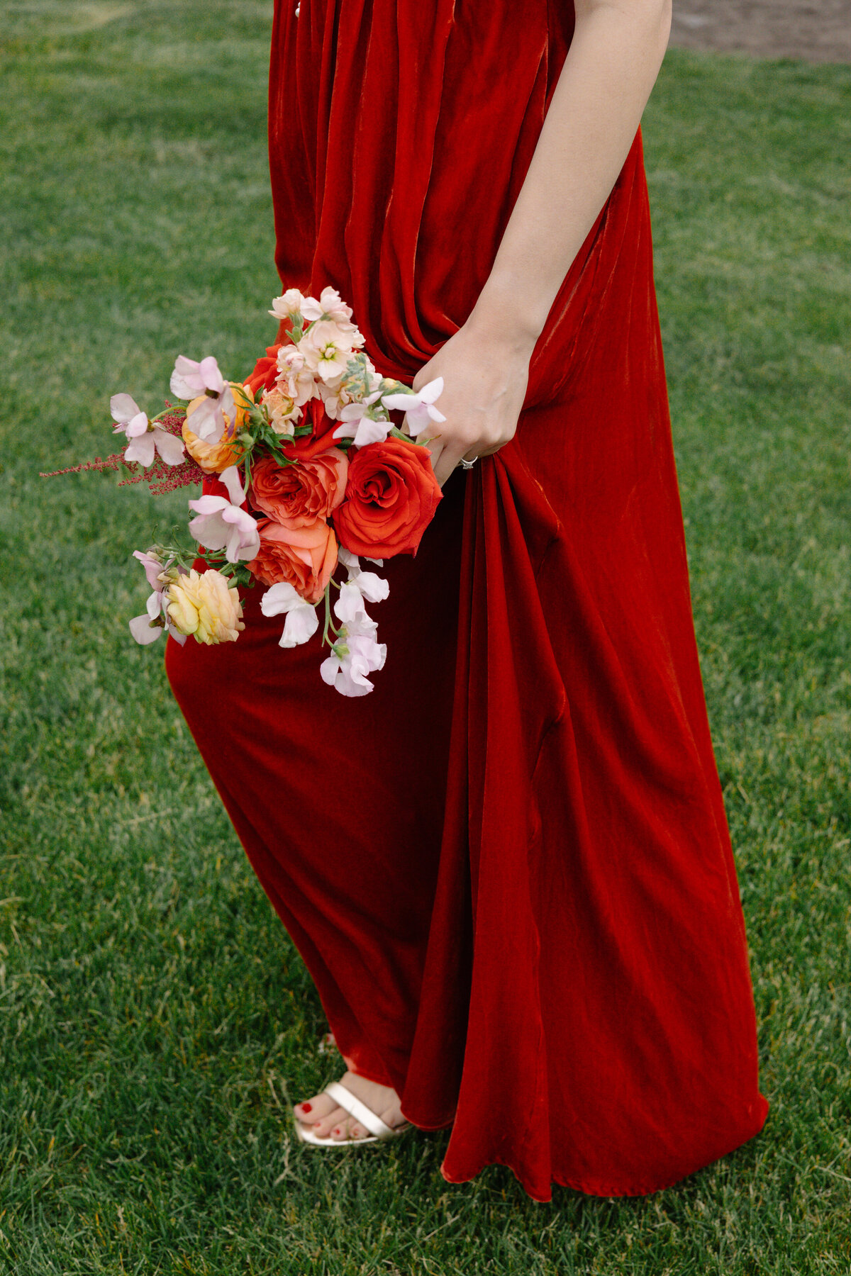 bridesmaid bouquet with red orange and green colors