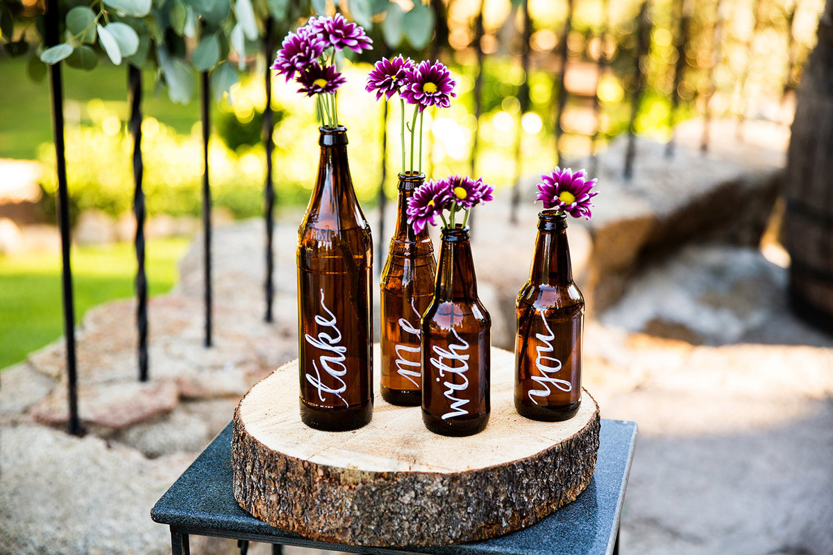 wedding photos beer bottles for flower holders centerpiece