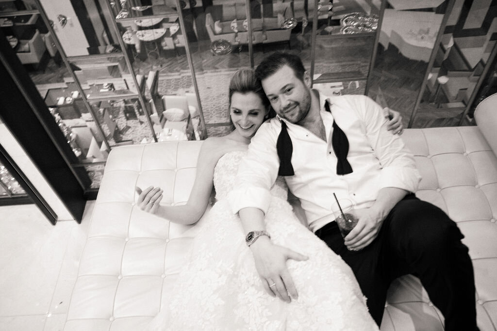 Black and white photo of the bride and groom at the end of the night. 