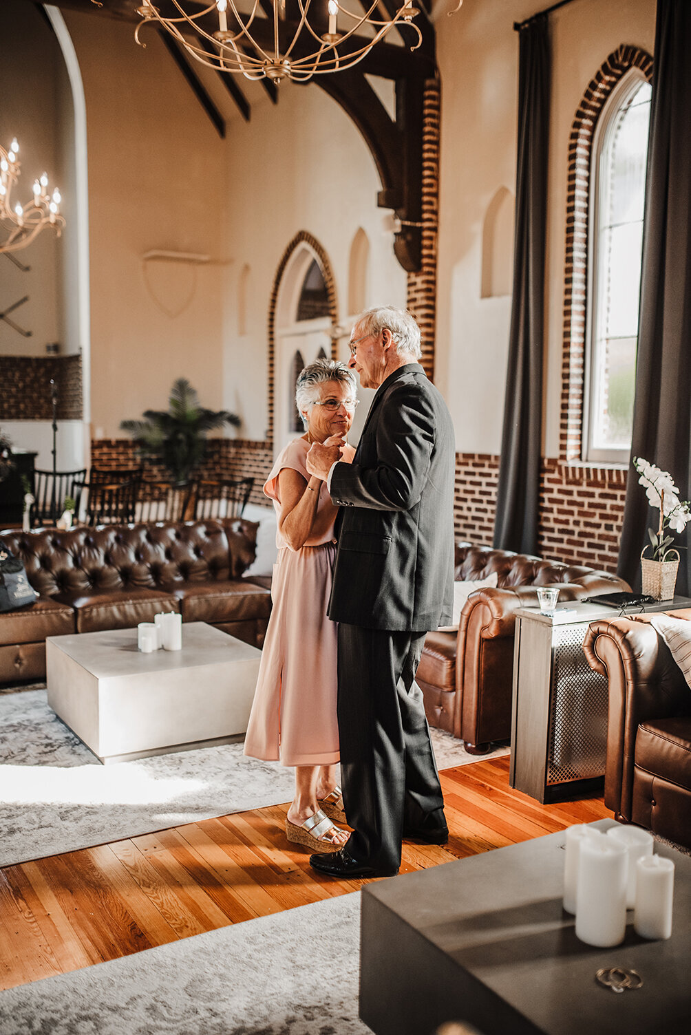 a moment before a ceremony of the grooms grandparents dancing