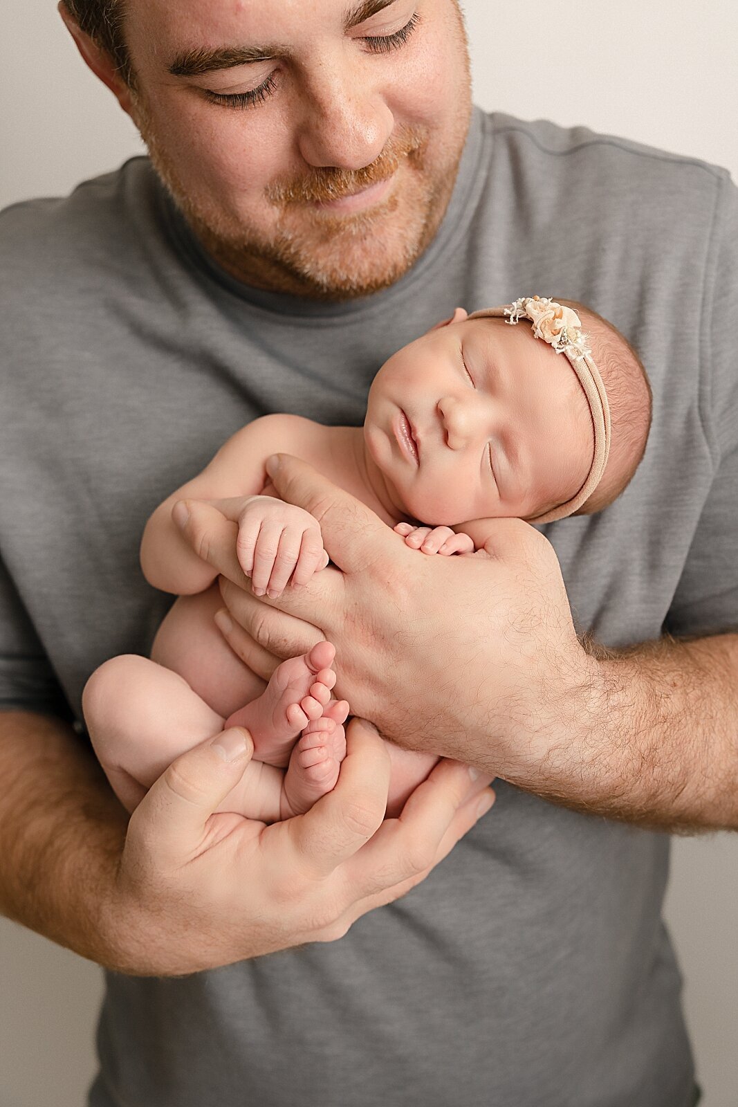 dad holding baby girl