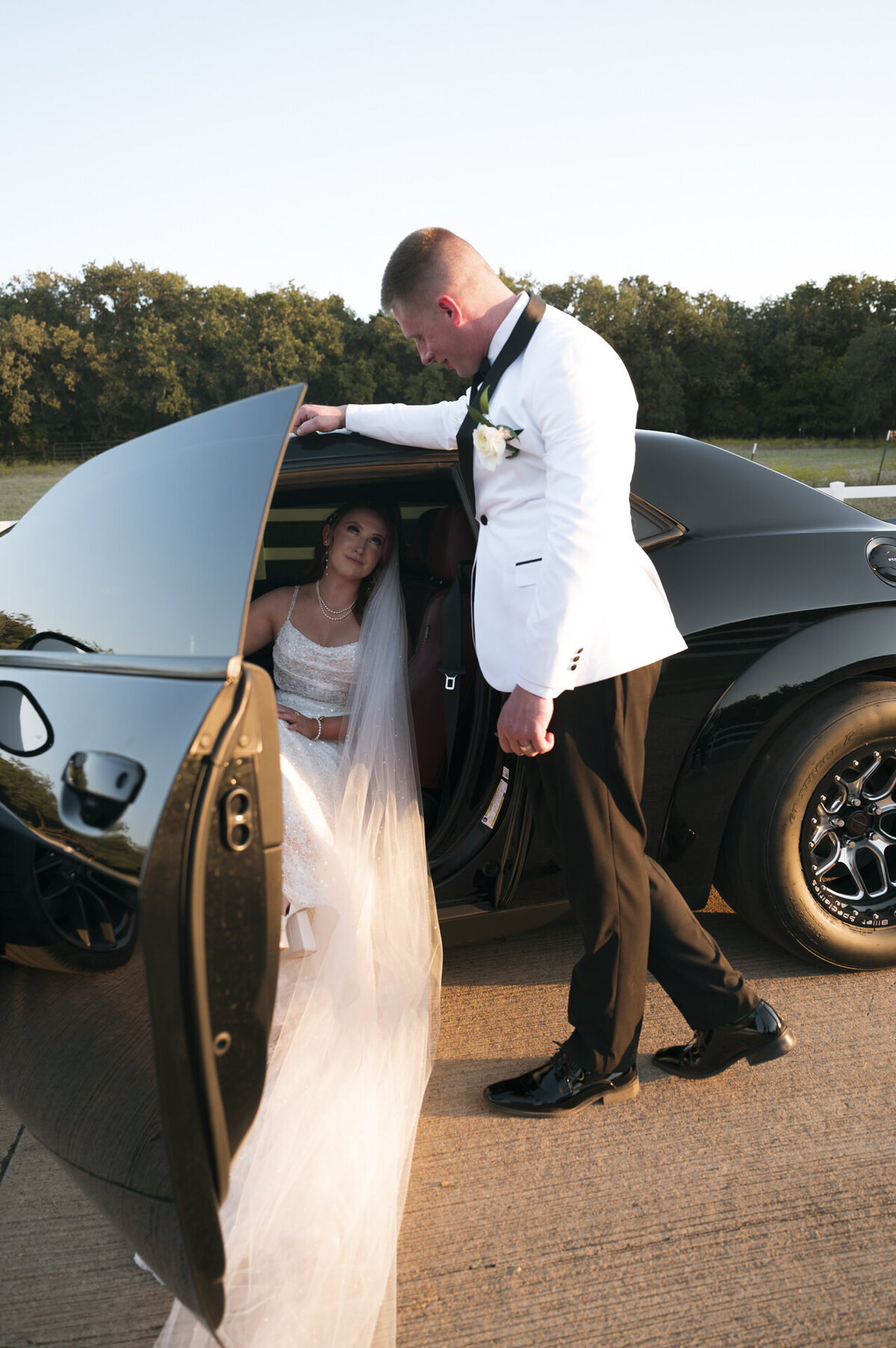 bride and groom taking photos just the two of them during golden hour in dallas