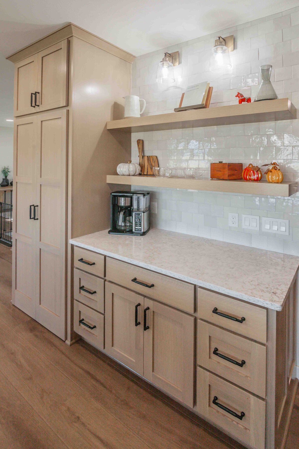 light wood cabinets and marble countertops