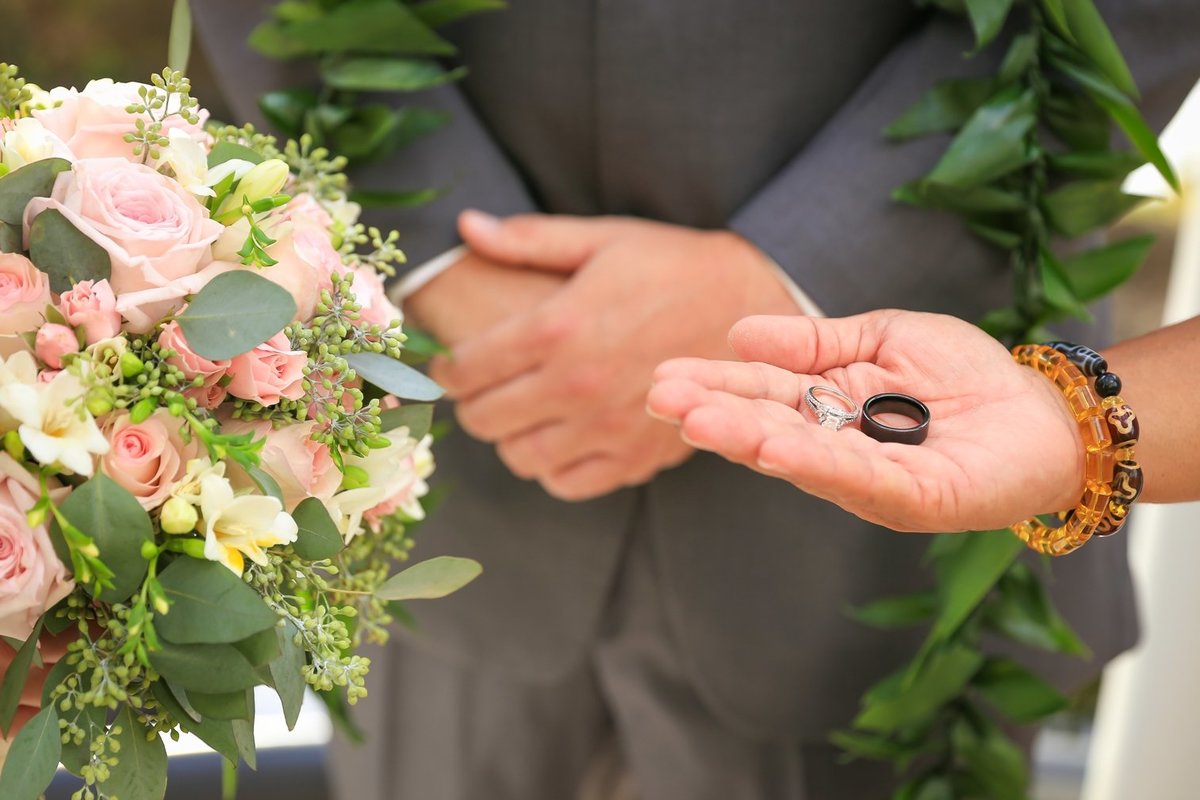 Capture Aloha Photography  and  hand the Wedding Rings