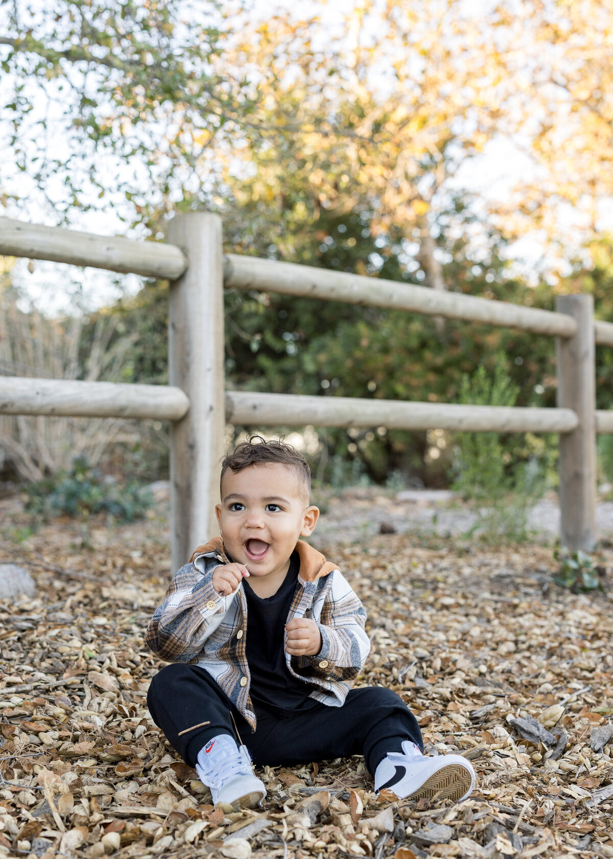 candid fall family photo in leaves