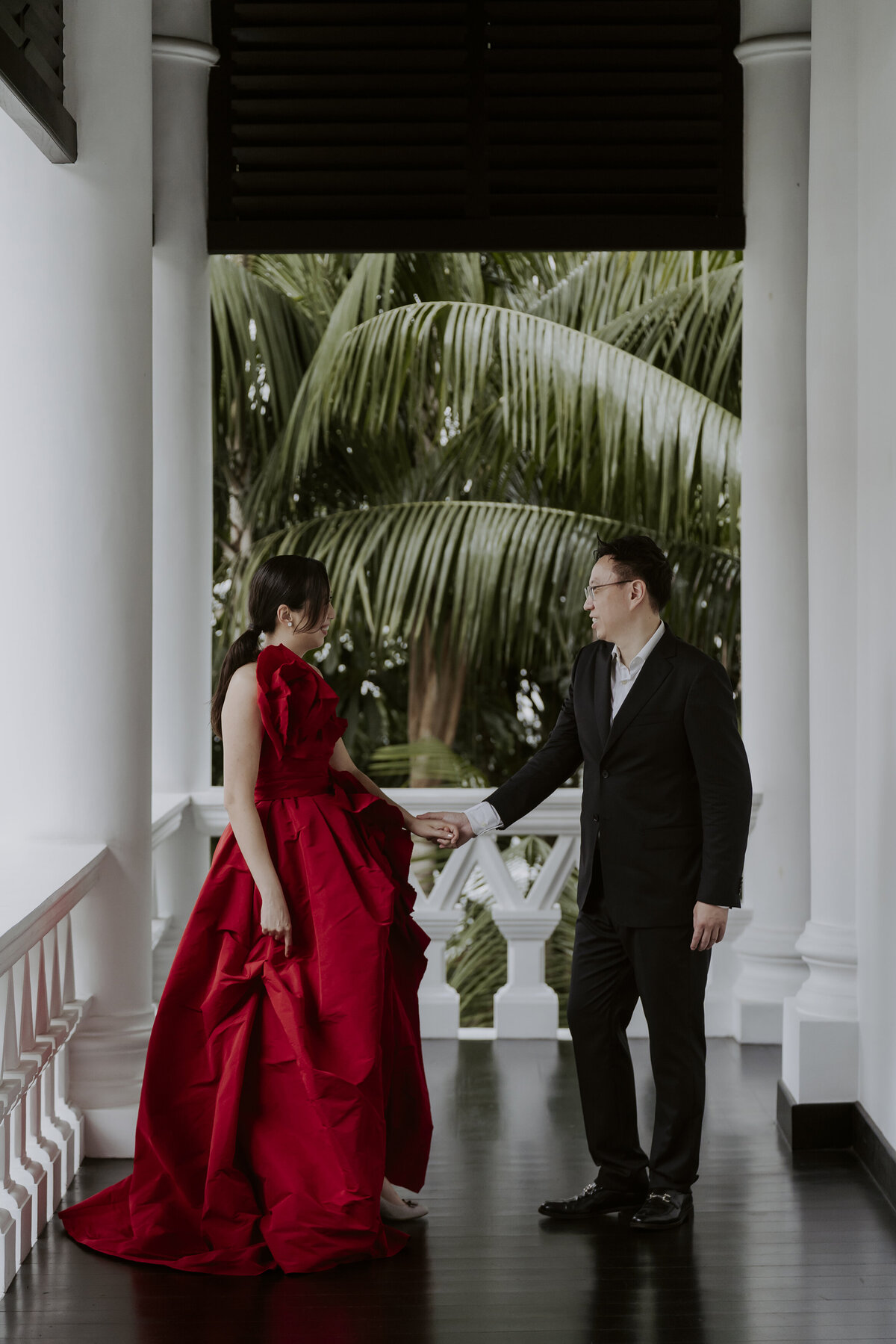 bride and groom walking while holding hands