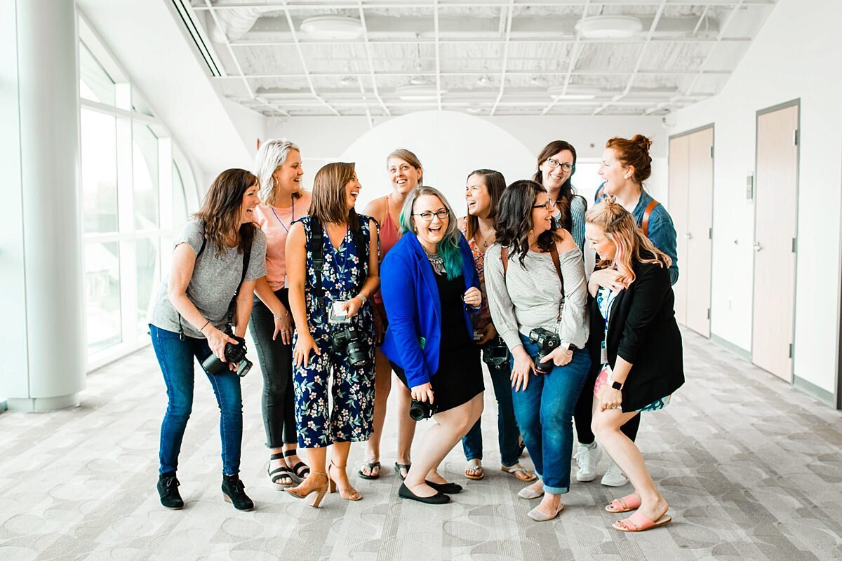 Group of photographers together for a retreat, laughing together