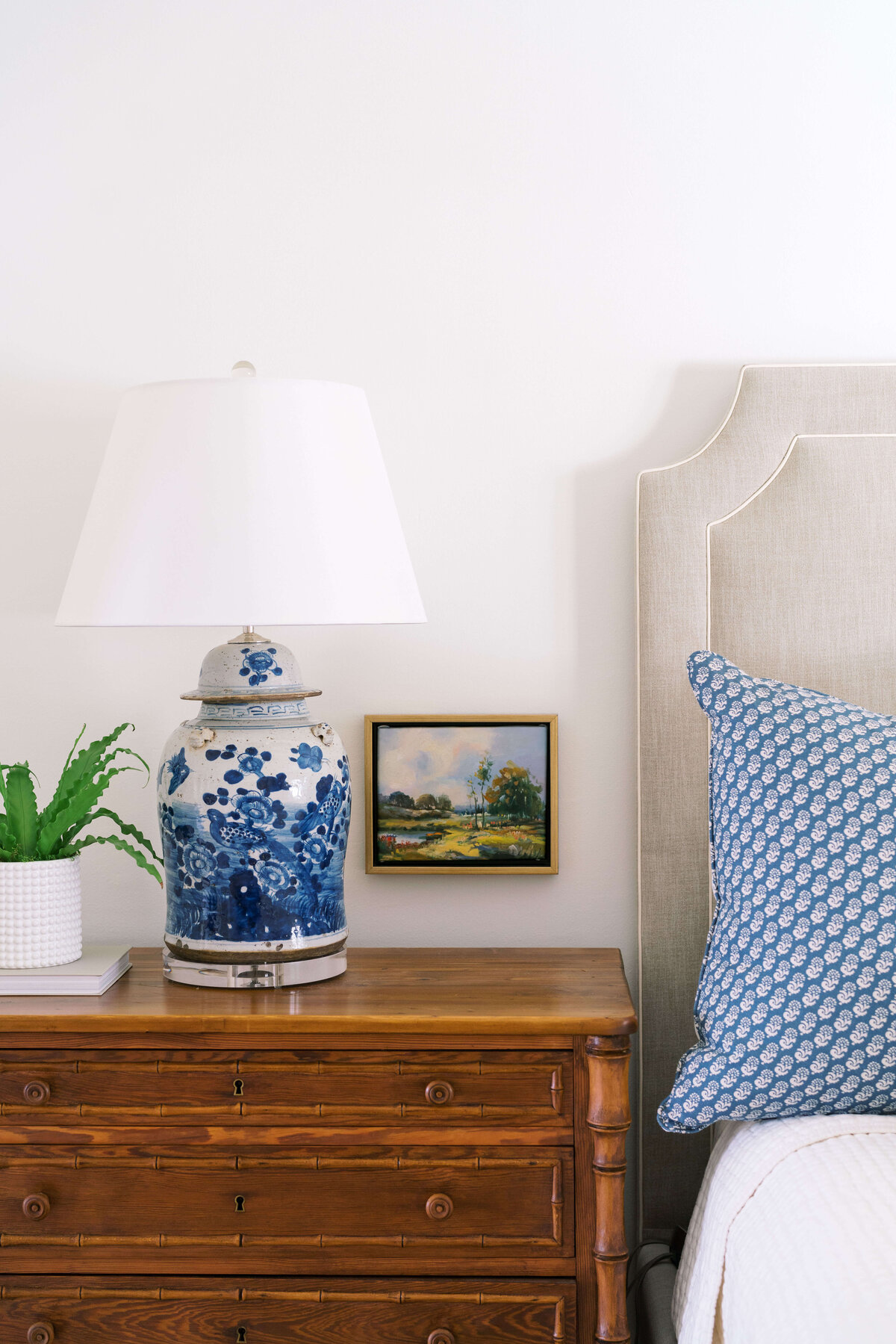oyster creek studios happy valley modern oriental lamp on a wooden bureau in bedroom