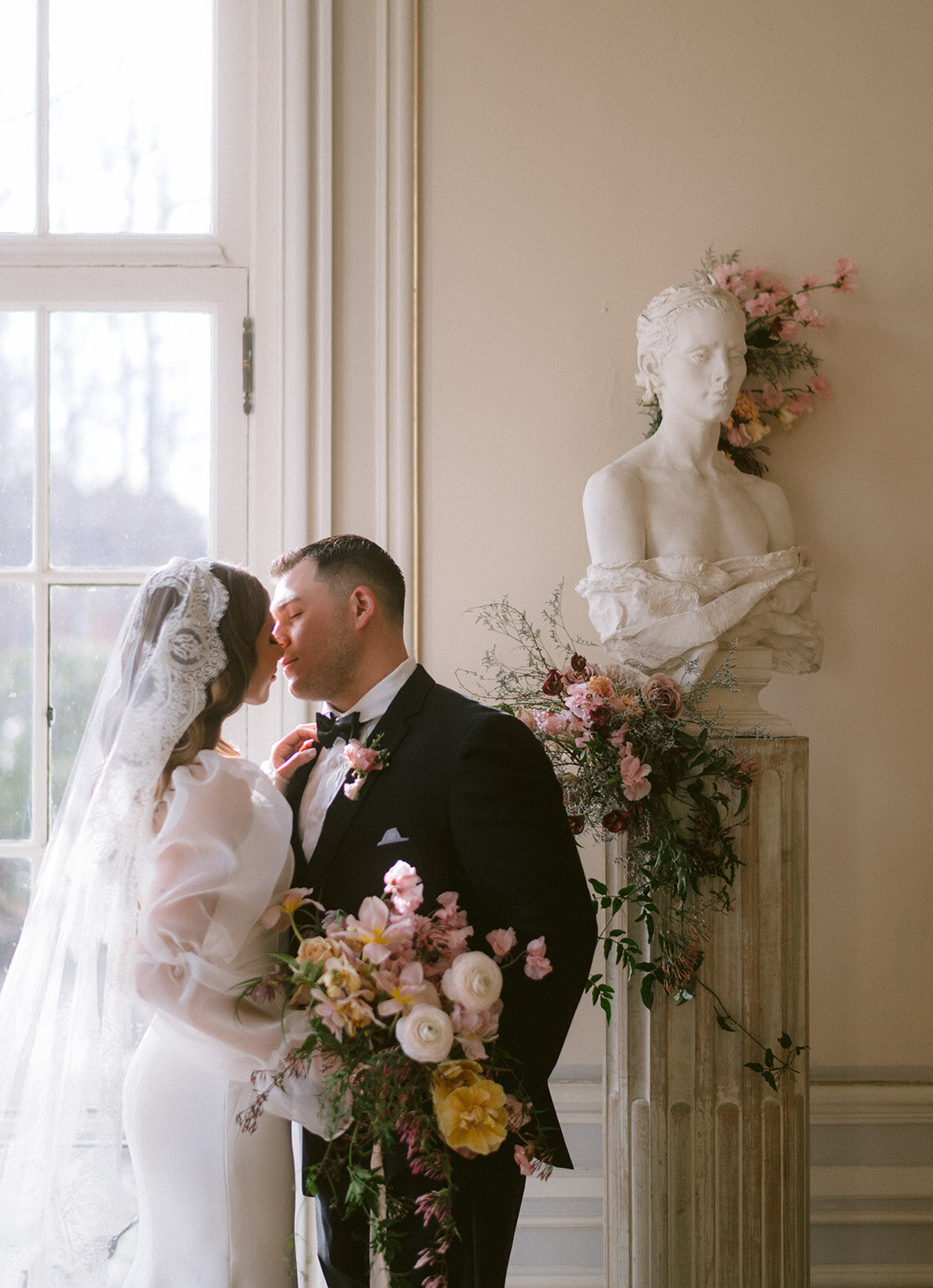 bride and groom kiss at their newport wedding venue photo by cait fletcher photography