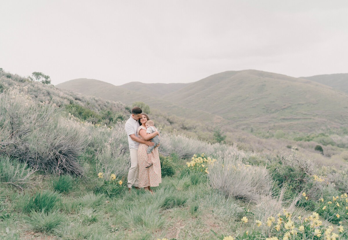 Mountain maternity session with glowing mom holding baby bump under soft light. CAPTURED BY Newborn Photography Salt Lake City, Newborn Photographer Riverton, Maternity Photographer Salt Lake City.