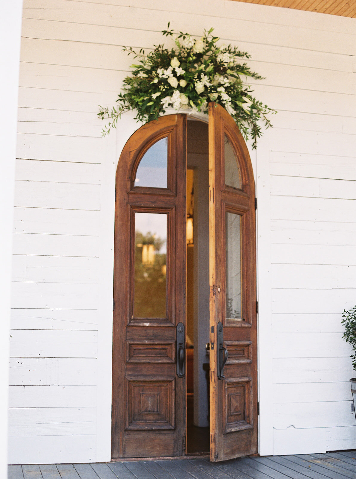 a brown wooden door at a wedding venue