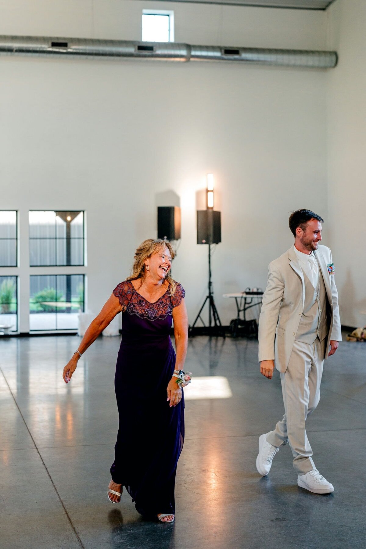 mother-son-laughing-wedding-reception