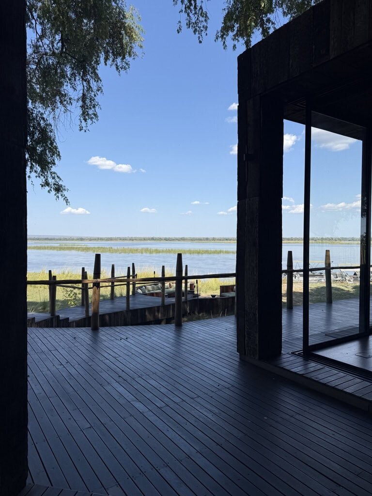 view from the deck of a house over a lake