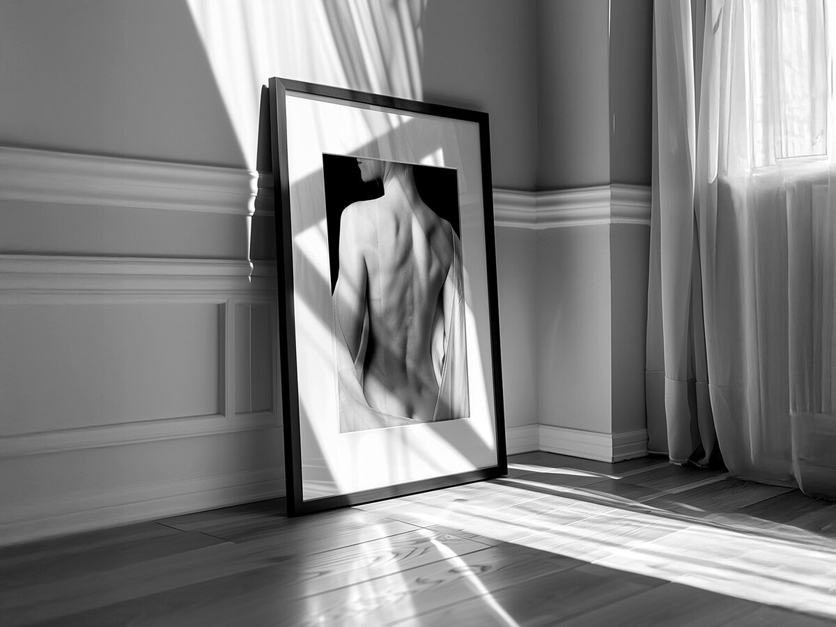 Matted framed female boudoir portrait standing on the floor, lit by sunshine