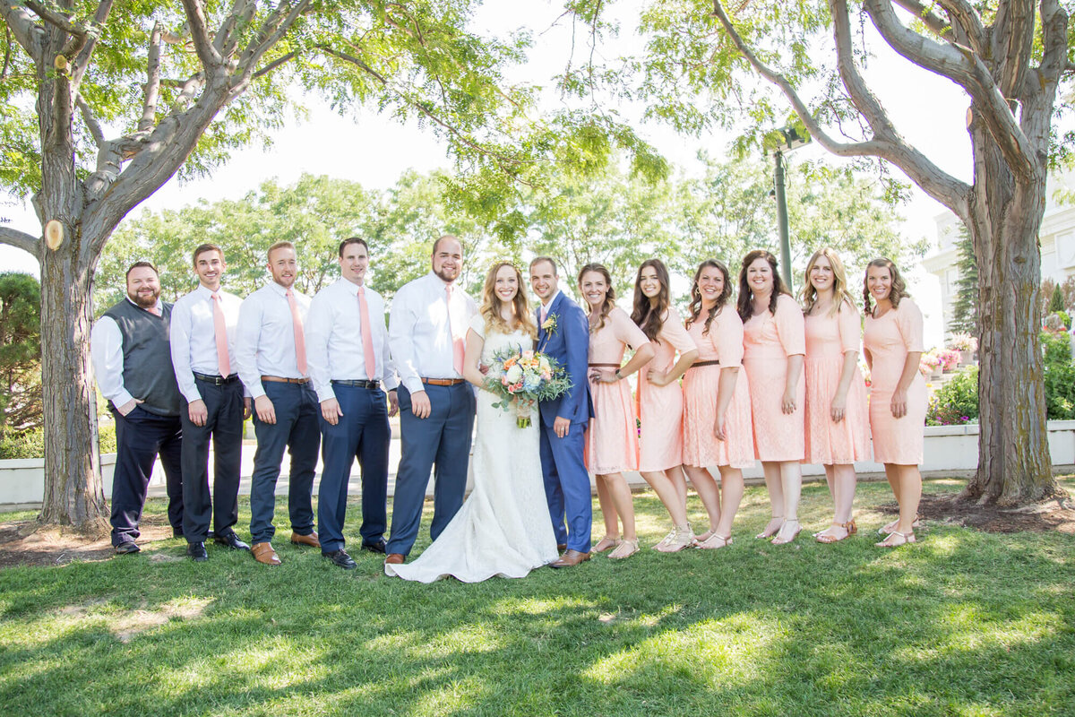 light and airy wedding photography by Jessica Bowles of bride and groom and wedding party om pink and white