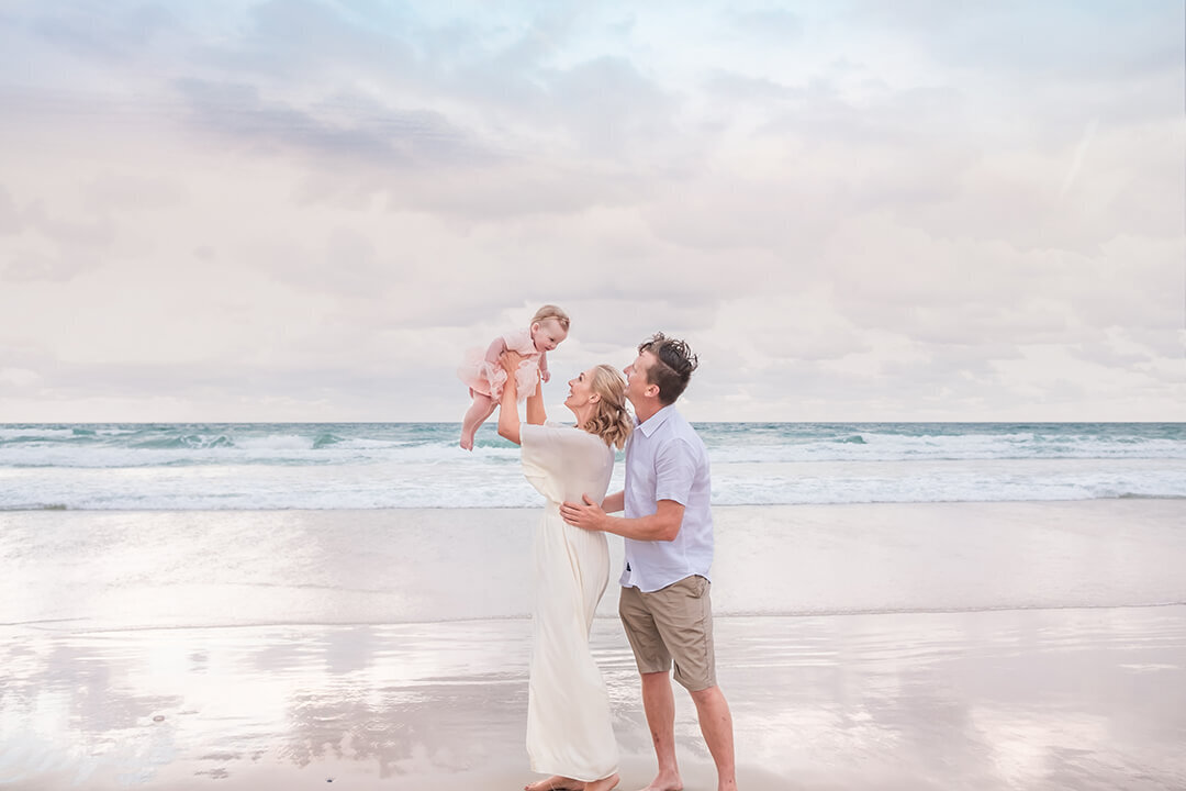 Light and airy family photo on a Brisbane beach: Summer time bliss with a family of 3