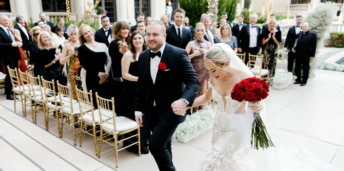 Beautiful couple walking up the steps at The Breakers, captured by Claudia Amalia, Miami wedding photographer