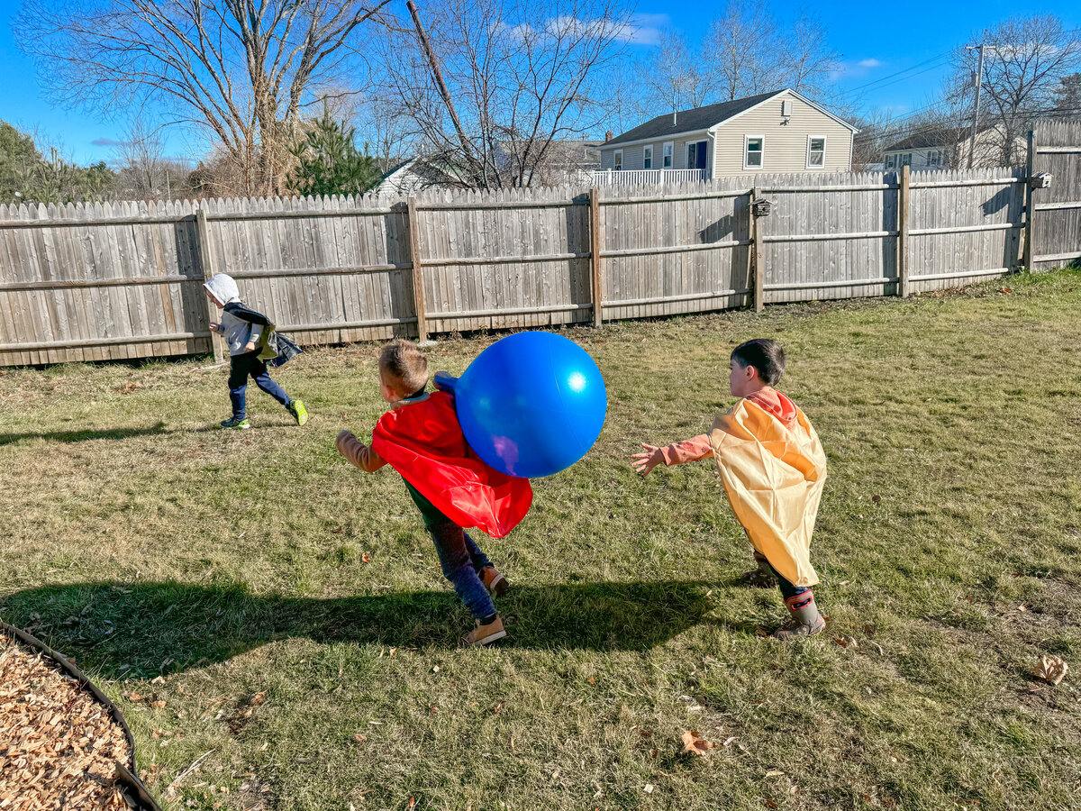 Students playing on the playground at House of Parker Preschool in Gorham Maine where the magic of play helps our students grow, learn, and thrive, making every moment a joyful step in their development.