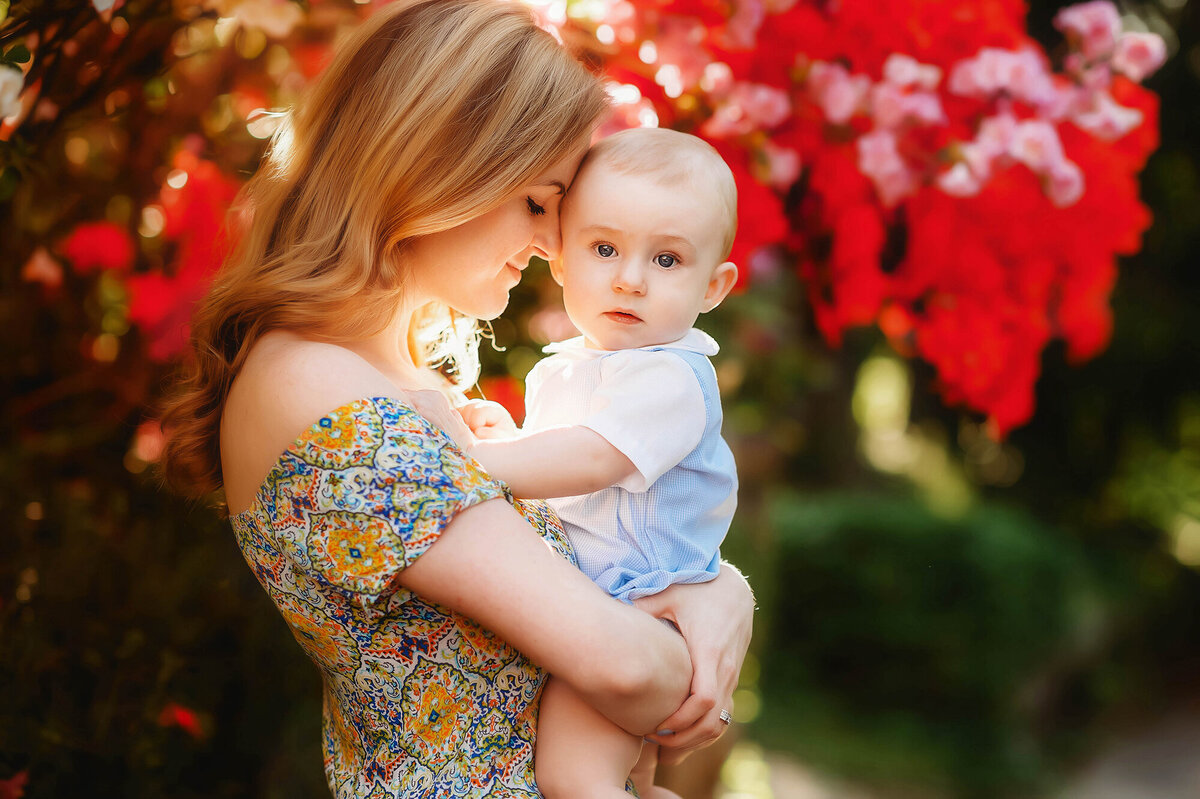 Mother embraces her baby during Family Photoshoot in Charleston, SC.