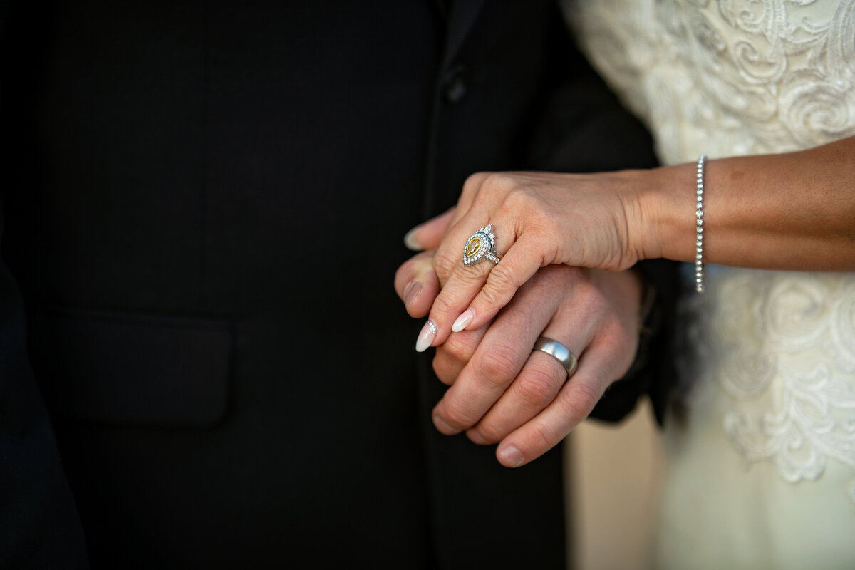 a picture of just married couples hands with rings