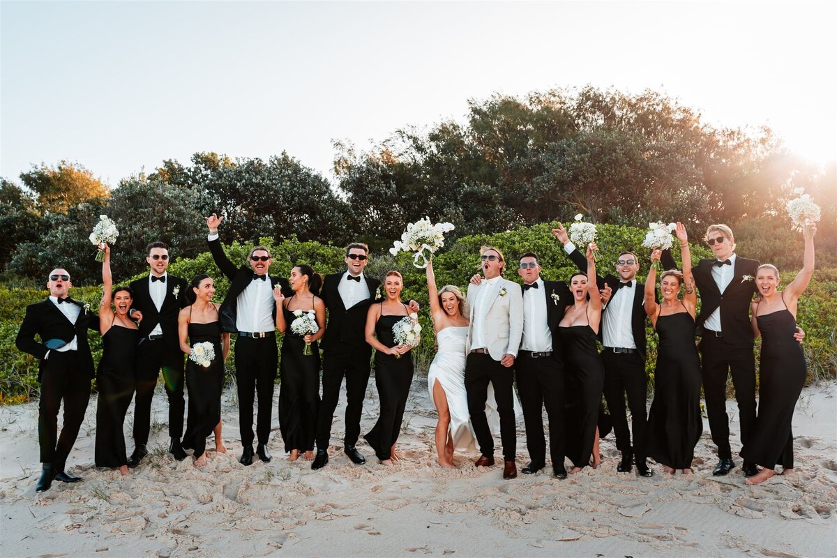Michaela & Luke together with the bridesmaids and groomsmen having a fun after wedding photo shoot!