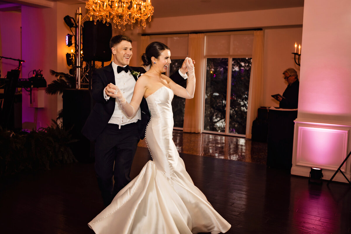 Celebrate bliss at an Austin Country Club. Mesh gloves, couture gowns, lush florals, and a reception rager under bold uplighting – where every detail is a luxurious celebration.