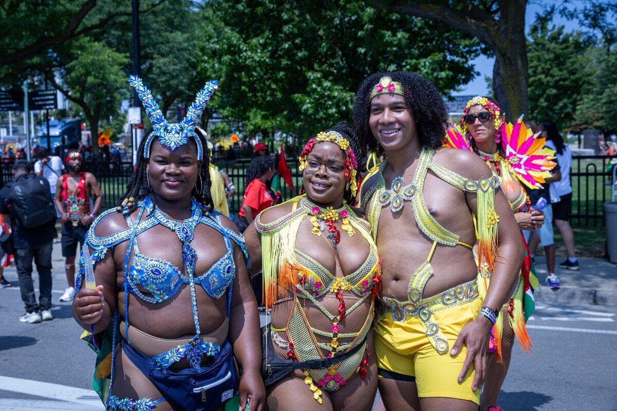 Toronto caribbean carnival parade masqueraders having fun in costume with Sunlime Mas, the number 1 medium size band at Toronto Carnival.