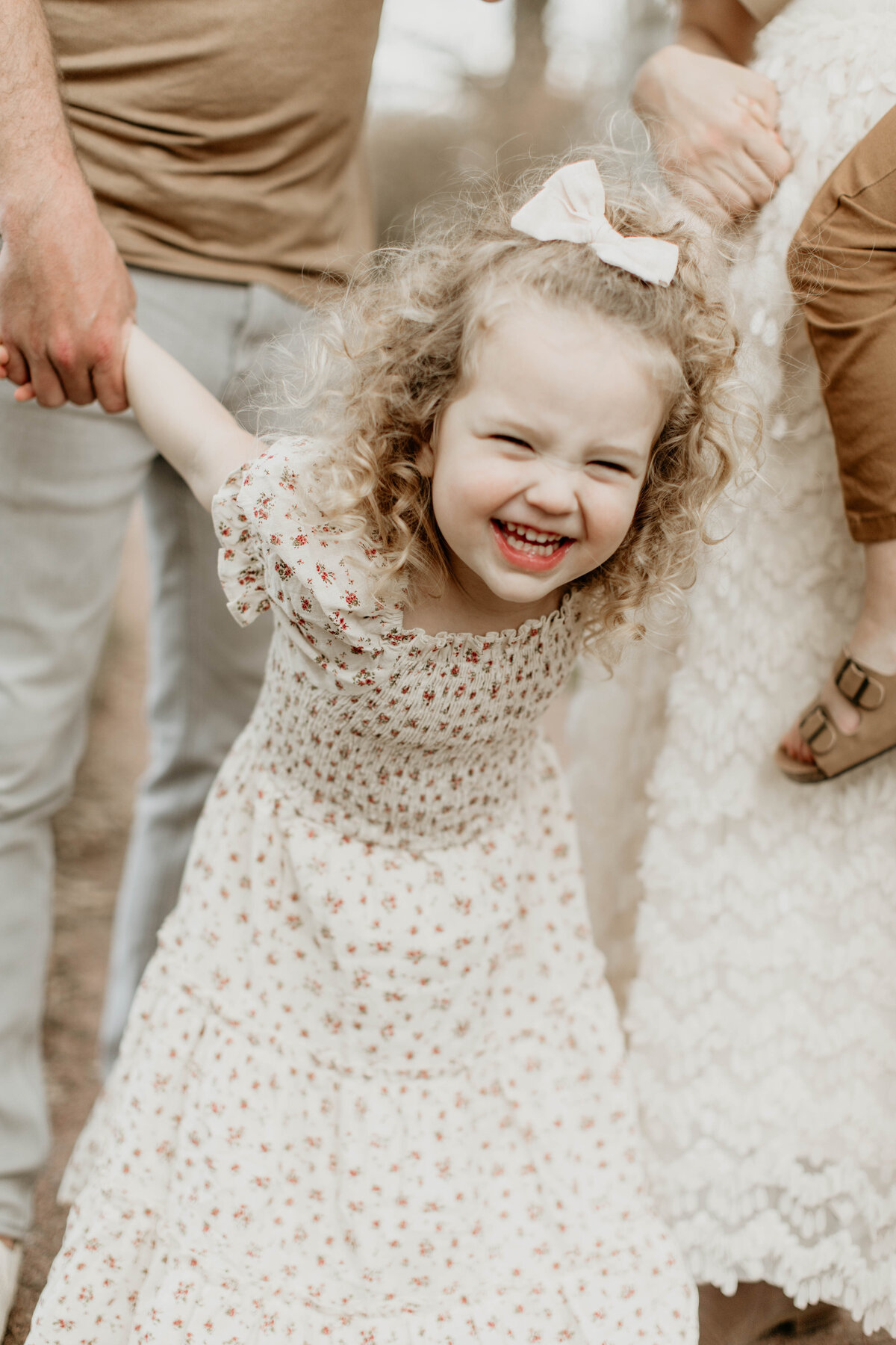 Candid photo of toddler laughing. 