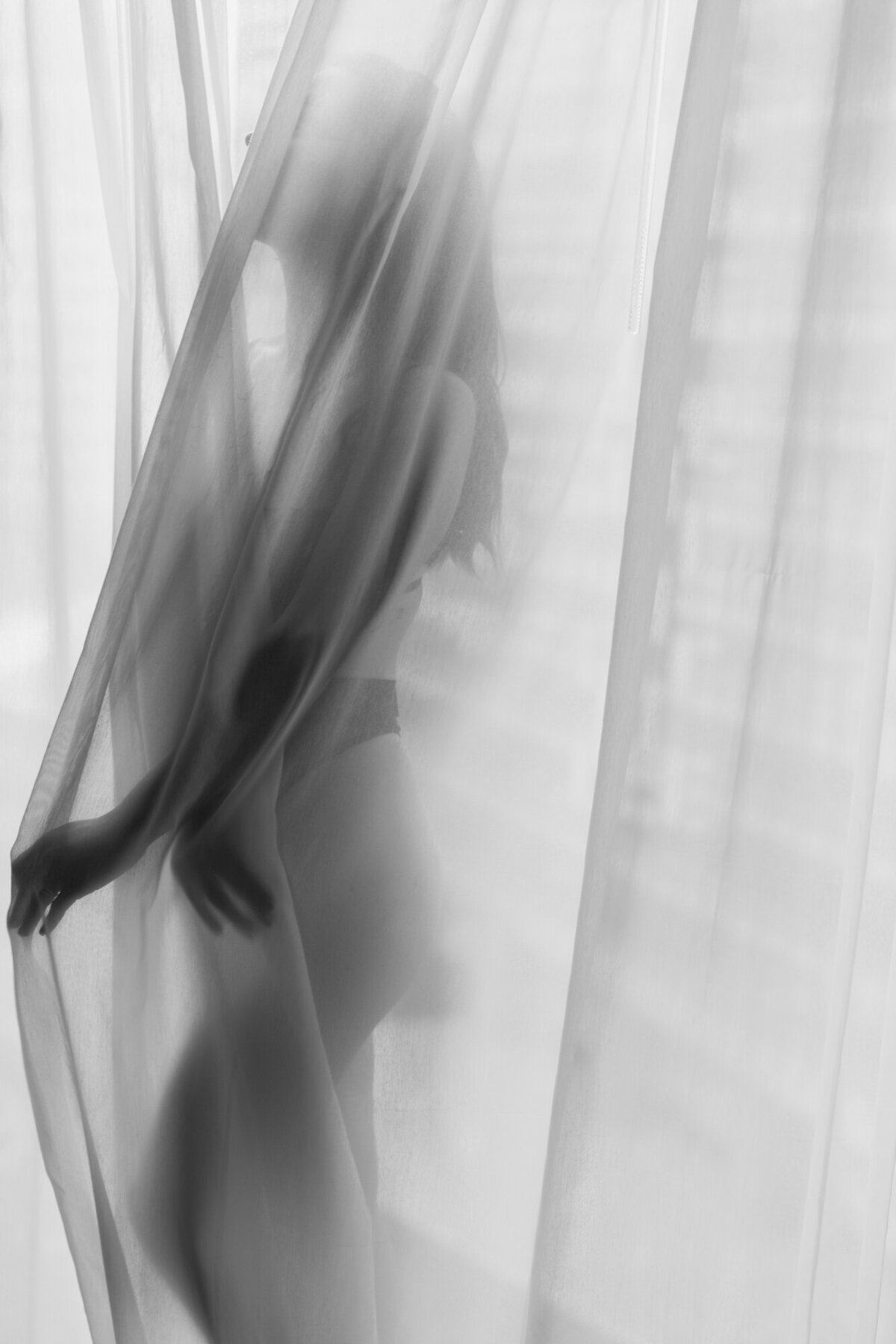 An artistic black and white boudoir photo